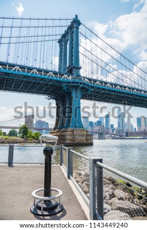 The Manhattan Bridge is a suspension bridge that crosses the East River in New York City ,connecting Lower Manhattan with DUMBO/Brooklyn.It's a double-decked and subway tracks are  on the lower deck.
