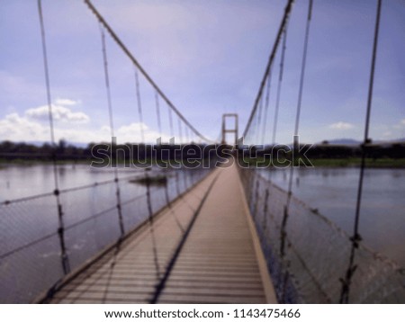 Blur picture of suspension bridge at Tak province, Thailand.