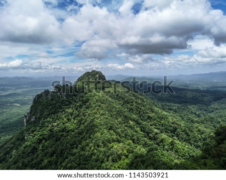 Beautiful scenic view of green jungle peak with amazing cloudy blue sky in Lampang province in thailand