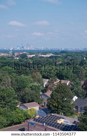 aerial view from highland park to minneapolis skyline with solar panels on rooftop 