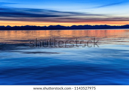 Beautiful sunset above the sea and mountain