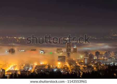 Portland Oregon downtown cityscape covered in Low Fog at Dawn