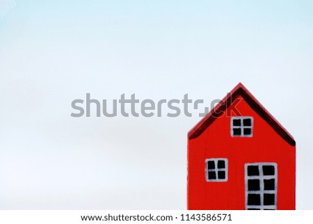 Red Wooden House Model isolated with Blured background - Business Property Concept with Copy space 