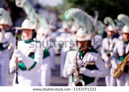 Blur Marching Band in white suit
