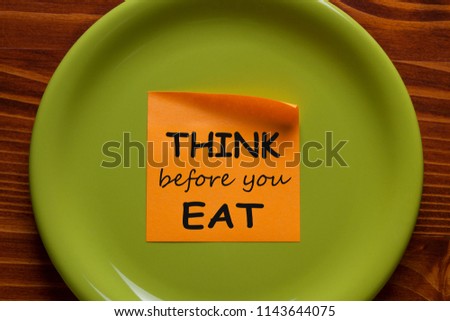 Think Before You Eat written on sticky note on the green plate. Health Tip. Royalty-Free Stock Photo #1143644075
