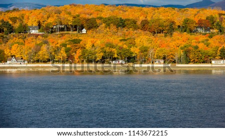 Autum View with Fall Colors on the St. Lawrence River, Canada Royalty-Free Stock Photo #1143672215
