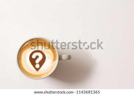Coffee cup with question mark in the froth concept for problems, uncertainty and asking questions Royalty-Free Stock Photo #1143681365