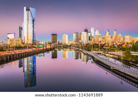 Philadelphia, Pennsylvania, USA downtown city skyline on the Schuylkill River at twilight.