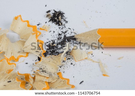 Pencil and sharpener on a white table. Accessories for drawing and sketching. White background.