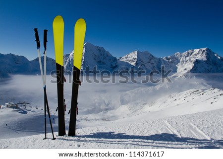 Skiing, winter season , mountains and ski equipment in the snow