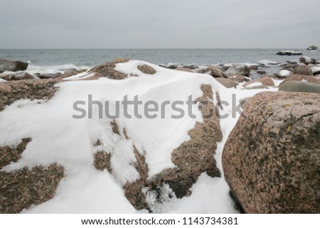 snowy cliff by the sea