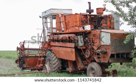 

old combine harvester for harvesting wheat and other agronomic crops