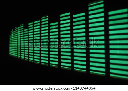 Yellow and green glowing light structure and graphic equalizer on a black background, splash screen
