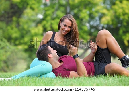 Young beauty smiling to camera with her boyfriend