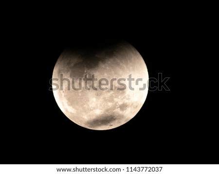 Eclipse moon in dark sky of Sao Paulo city, Brazil
