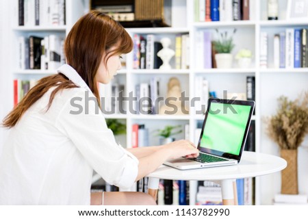asian woman using laptop