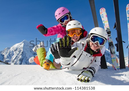 Winter, ski, snow and fun  - family enjoying ski holiday