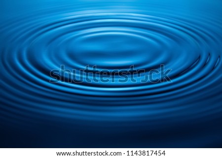 Blue of water drop and splash. The water rings