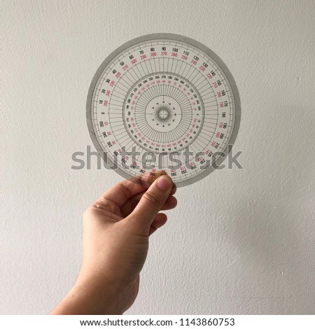 the circle ruler protractor in model's hand