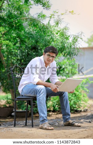 young Indian man using laptop , Working on Laptop