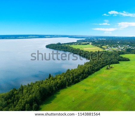 Aerial view of seashore with beach, lagoons. Coastline with sand and water. Tropical landscape. Aerial photography. Birdseye. Lake, beach, sky, clouds.