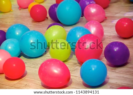 Balloons of different colors lie on the floor as a decoration for a children's party or birthday.