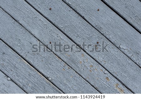Oblique old blue wooden background pattern with cracks. Dirty because long people using. Varnished wood textured background