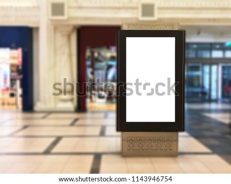 Empty indoor portrait digital signage light box with blurred mall background. Ideal for digital advertisement, information board, mall ads, video wall and large posters for campaigns