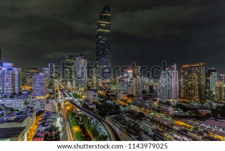 City scape of building, skyscraper in the Silom/Sathon central business district of Bangkok as the tallest building in Thailand, panorama view at night