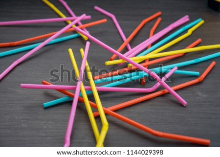 Mixed color of straw sticks isolated with black background