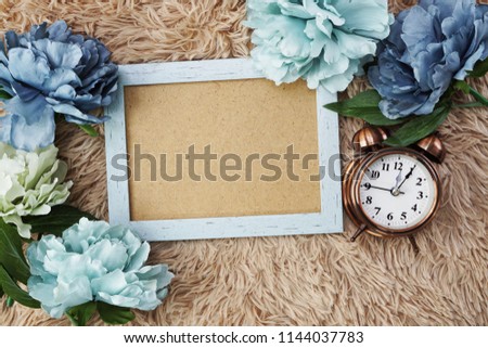 space copy on photo frame and flower mock up flat lay