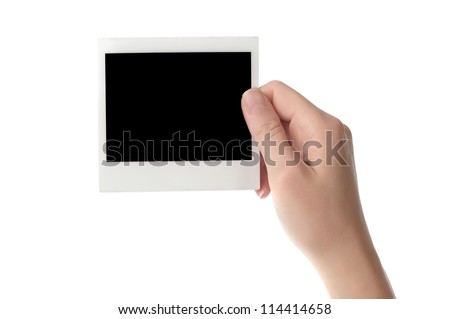 Women hand holding blank photo frame