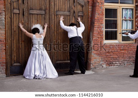 Comic picture of a wedding in the style of gangsters