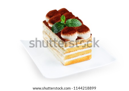 Tiramisu cake on a white plate isolated. toning. selective focus