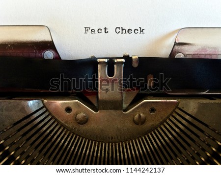 Fact Check, heading title typewritten in black ink on white paper on vintage retro old fashioned obsolete typewriter machine Royalty-Free Stock Photo #1144242137