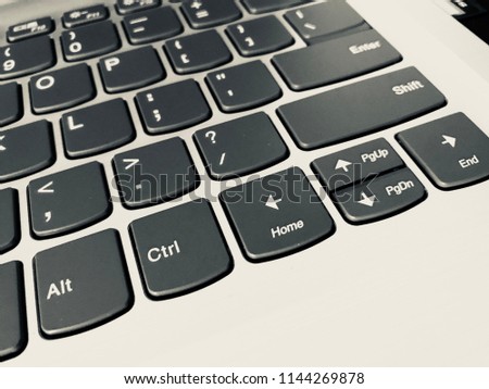 Keyboard / A computer keyboard is a typewriter style device which uses an arrangement of buttons or keys to act as mechanical levers or electronic switches Royalty-Free Stock Photo #1144269878