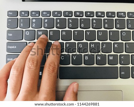 Keyboard / A computer keyboard is a typewriter style device which uses an arrangement of buttons or keys to act as mechanical levers or electronic switches Royalty-Free Stock Photo #1144269881