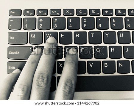 Keyboard / A computer keyboard is a typewriter style device which uses an arrangement of buttons or keys to act as mechanical levers or electronic switches Royalty-Free Stock Photo #1144269902