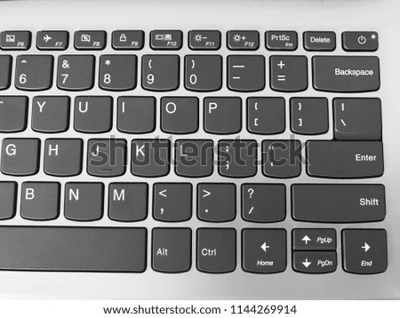 Keyboard / A computer keyboard is a typewriter style device which uses an arrangement of buttons or keys to act as mechanical levers or electronic switches Royalty-Free Stock Photo #1144269914