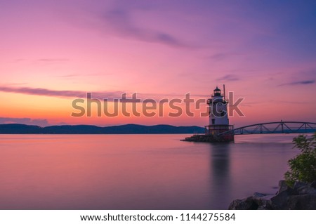 
Gorgeous sunset over Sleepy Hollow lighthouse viewed from Tarrytown in New York State's Hudson Valley, shot using slow shutter speed 