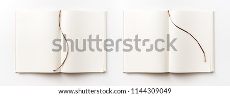 Business concept - Top view collection of  light yellow fabric notebook brown curve band and white open page isolated on background for mockup