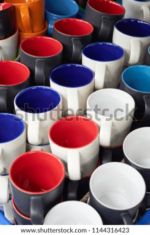 colorful of ceramic bowl or plastic cup on sale in street market . selective focus