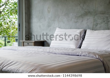 Modern cement interior style in double bedroom, modern wooden shelves