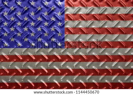 USA flag with over steel diamond metal plate. Worn diamond plate surface with dirt and grit.