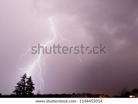 Lightnings striking above the forest