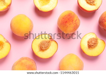 Flat lay composition with ripe peaches on color background Royalty-Free Stock Photo #1144463015