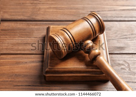 Judge's gavel on wooden background. Law concept