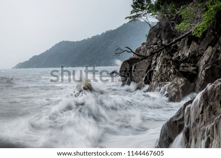 waves on the ocean.
High waves hitting the rocks.
Storm sea.
