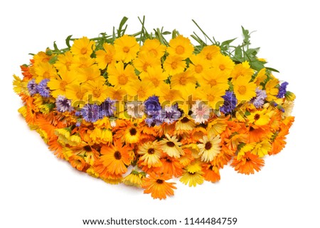Bouquet is beautiful oval form with flowers of calendula, koreopsis and cornflowers. Yellow, orange and blue. Creative arrangement. Useful and medicinal herbs. Flat lay, top view