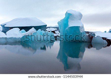 Beautiful iceberg picture of icelandic at glacier lagoon in Iceland. Sunset light in the Ice Lagoon. 
